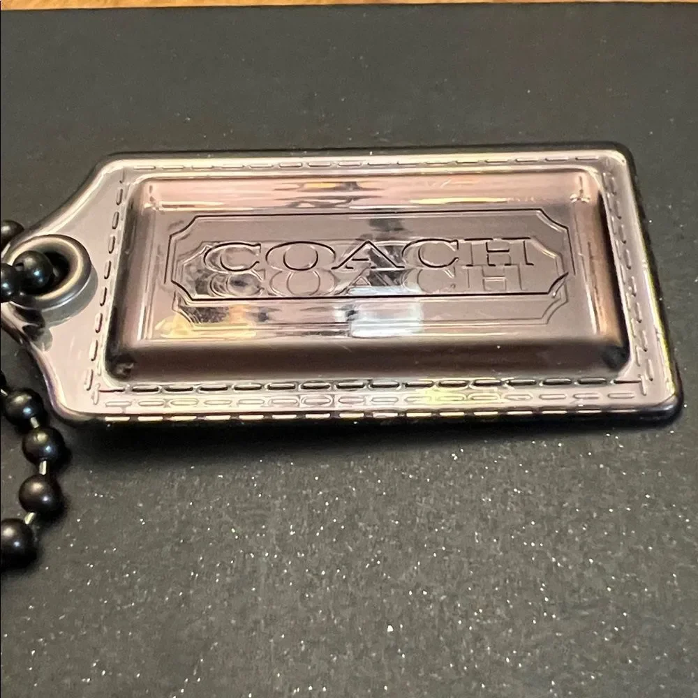Coach Poppy plastic hangtag smoky gray with chunky ballchain